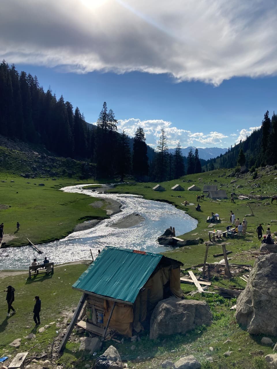 Riverside camping view at Kund Banda in Kumrat Valley.